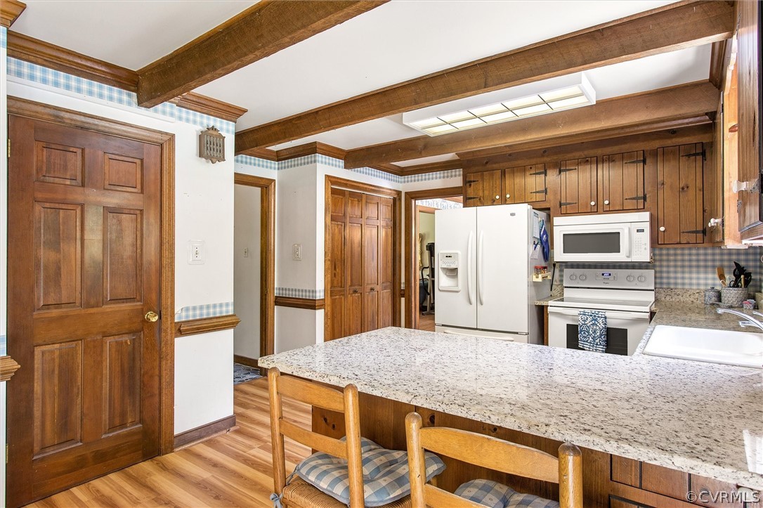 22601 Skinquarter Road Moseley, VA 23120 - Photo 13 of 50 a kitchen with a refrigerator and countertop