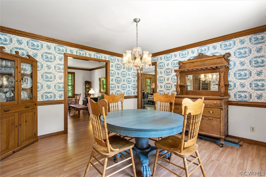 22601 Skinquarter Road Moseley, VA 23120 - Photo 18 of 50 a view of a dining room with furniture and wooden floor