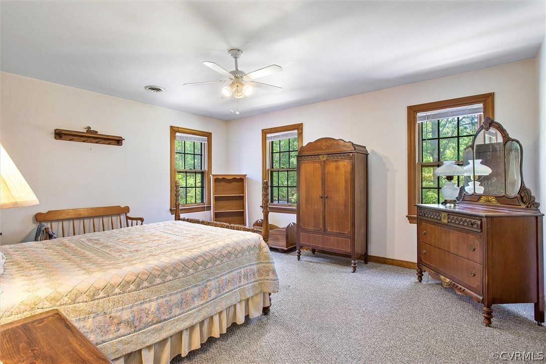 22601 Skinquarter Road Moseley, VA 23120 - Photo 27 of 50 a bedroom with a bed dresser and a window