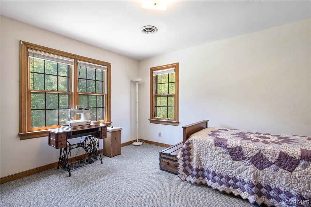 22601 Skinquarter Road Moseley, VA 23120 - Photo 29 of 50 a bedroom with a bed and a desk