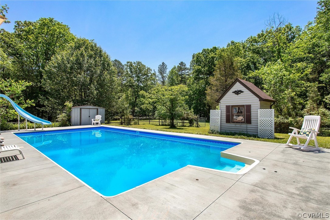 22601 Skinquarter Road Moseley, VA 23120 - Photo 35 of 50 a view of house with swimming pool outdoor seating area and entertaining space