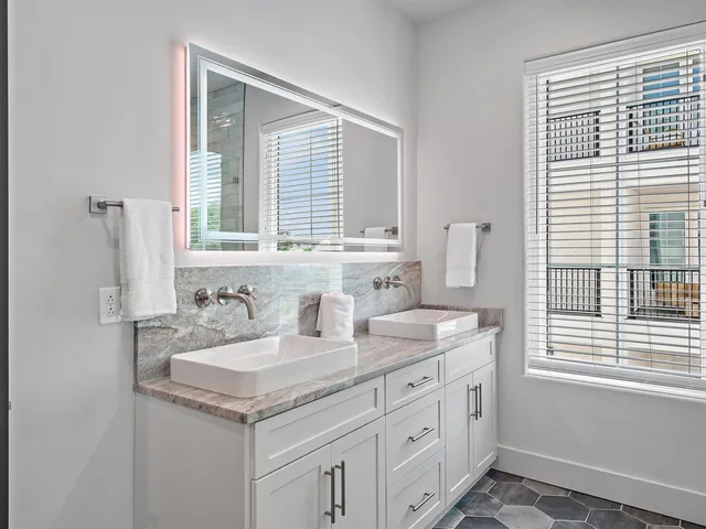 a bathroom with a sink and a window