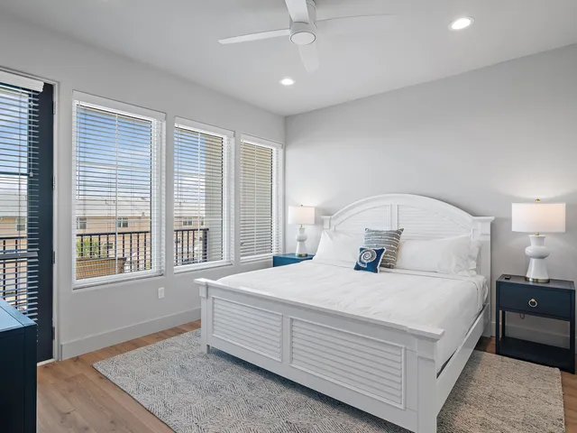 a bedroom with a large bed and a window
