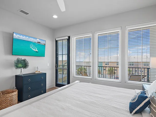 a bed room with a bed and a television