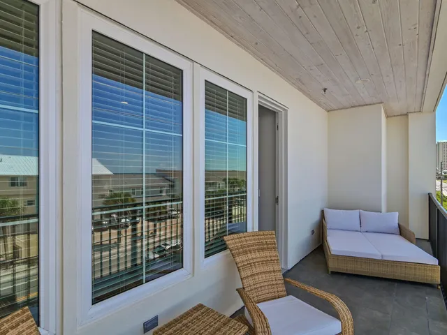 a outdoor living space with furniture and a potted plant