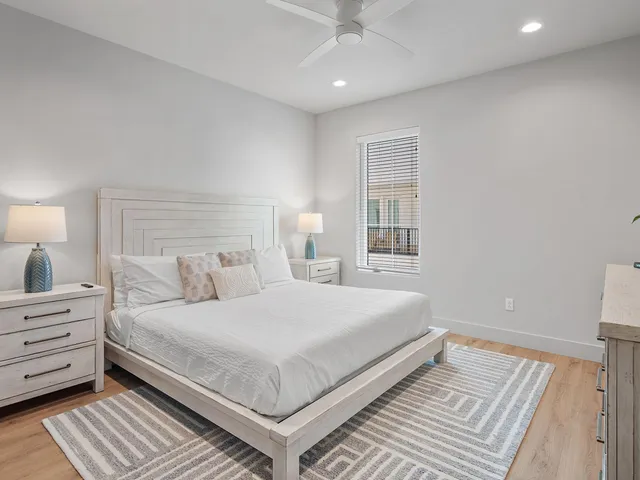 a bedroom with a large bed and a window