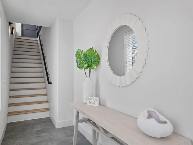 a front view of a house with wooden floor and glass windows