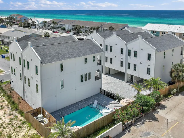 a view of a wrought iron fences in front of house