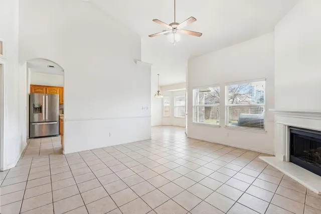 a living room with lots of furniture and a chandelier