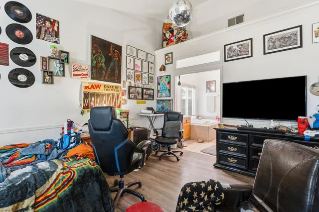 a bathroom with a granite countertop sink and a bathtub