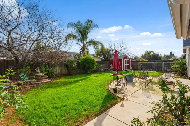 a front view of house with yard and outdoor seating