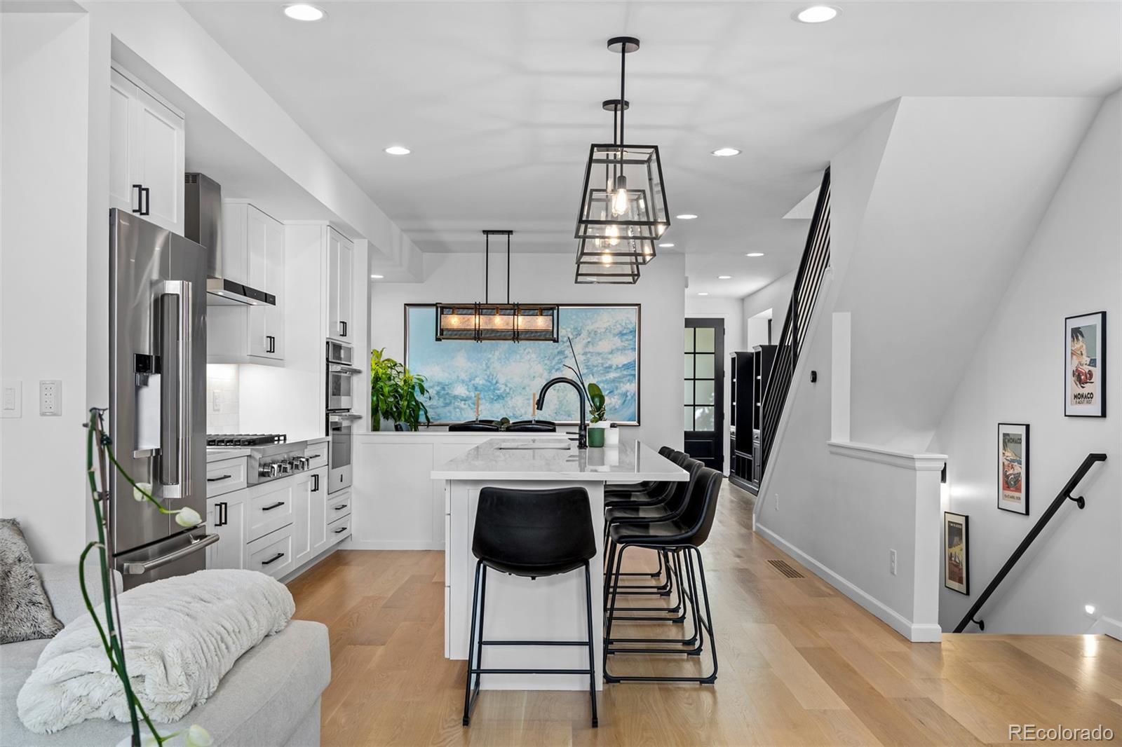 3451 Quivas Street Denver, CO 80211 - Photo 15 of 50 a view of a livingroom with furniture wooden floor and a chandelier
