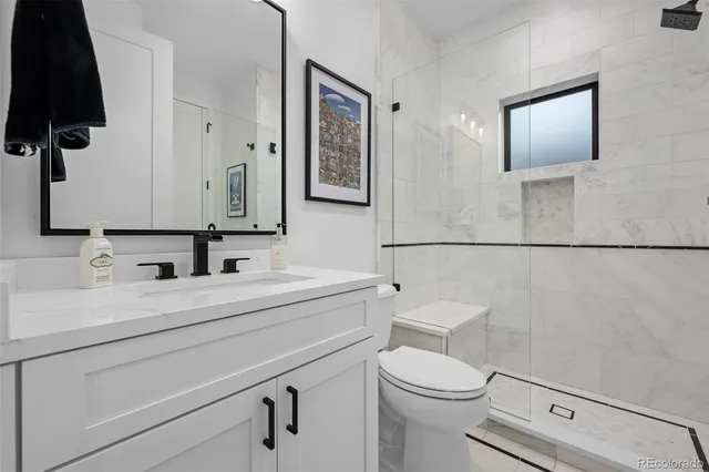 a bedroom with a large bed and a large window