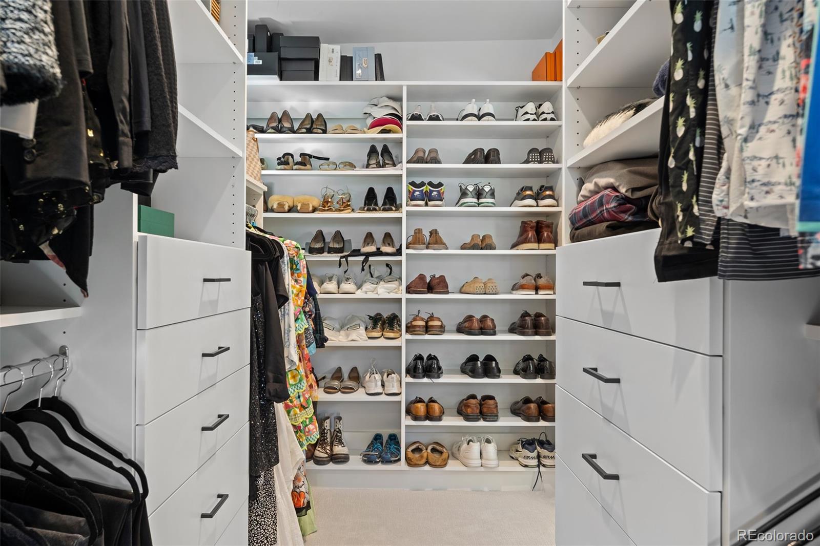 3451 Quivas Street Denver, CO 80211 - Photo 27 of 50 a view of walk in closet with clothes and shoes
