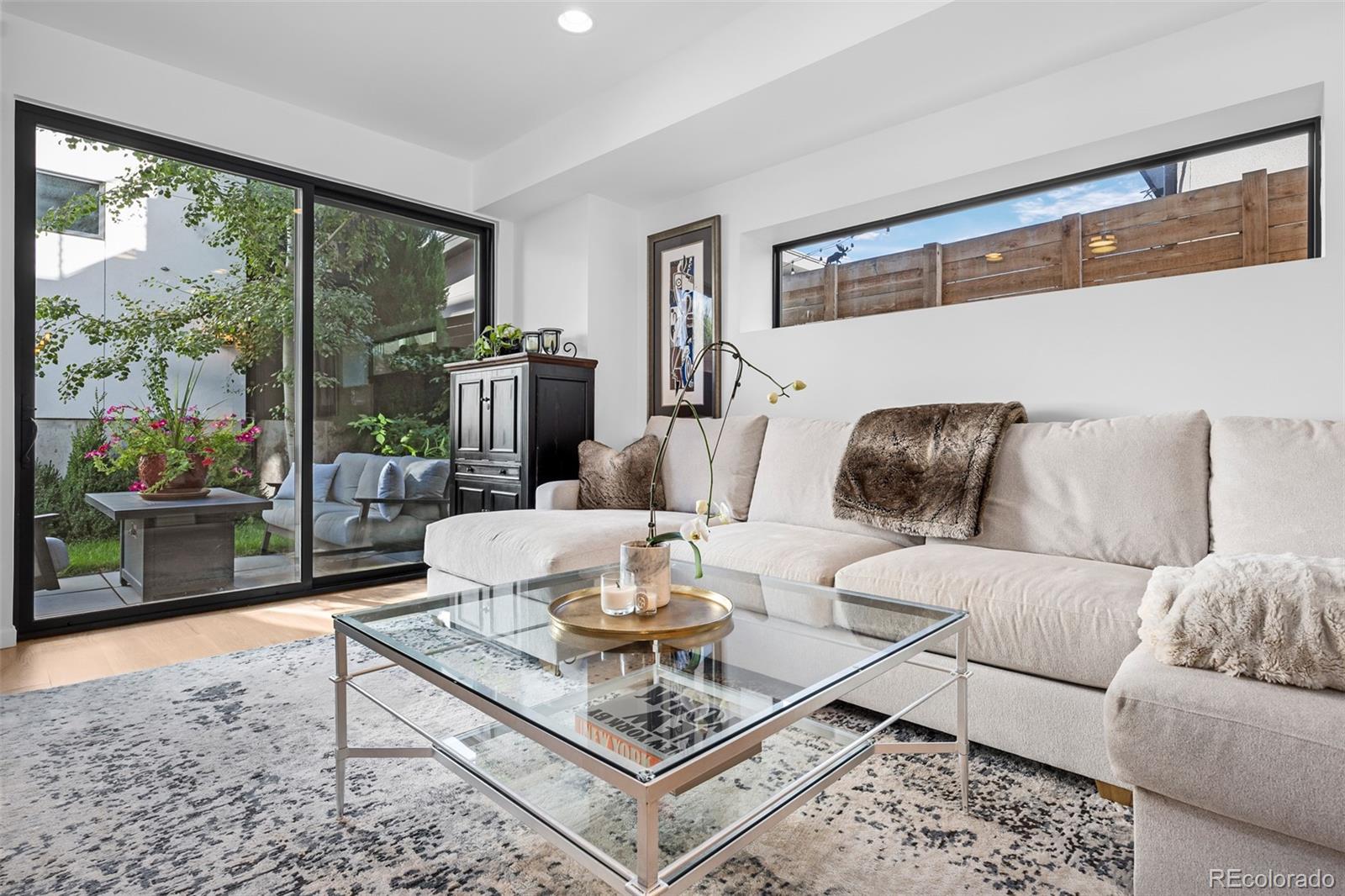 3451 Quivas Street Denver, CO 80211 - Photo 9 of 50 a living room with furniture and a floor to ceiling window