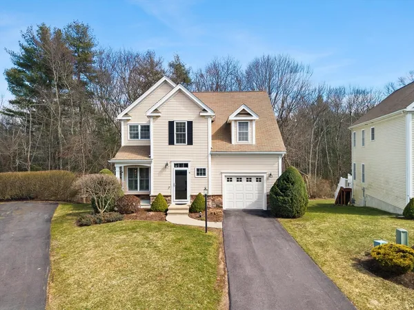 a view of a house with a yard patio and couches
