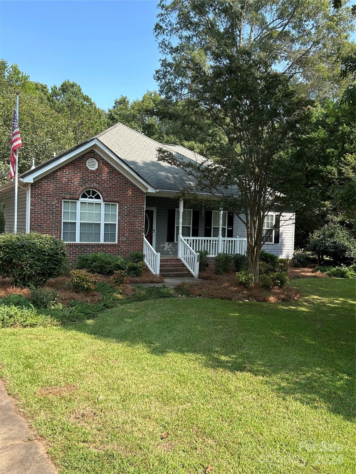 993 West Shiloh Unity Road Lancaster, SC 29720 - Photo 1 of 26 a front view of a house with a garden