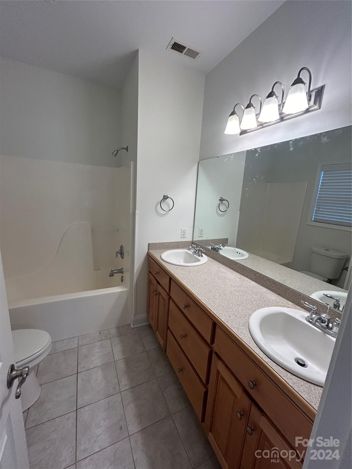 993 West Shiloh Unity Road Lancaster, SC 29720 - Photo 13 of 26 a bathroom with a sink double vanity and a tub