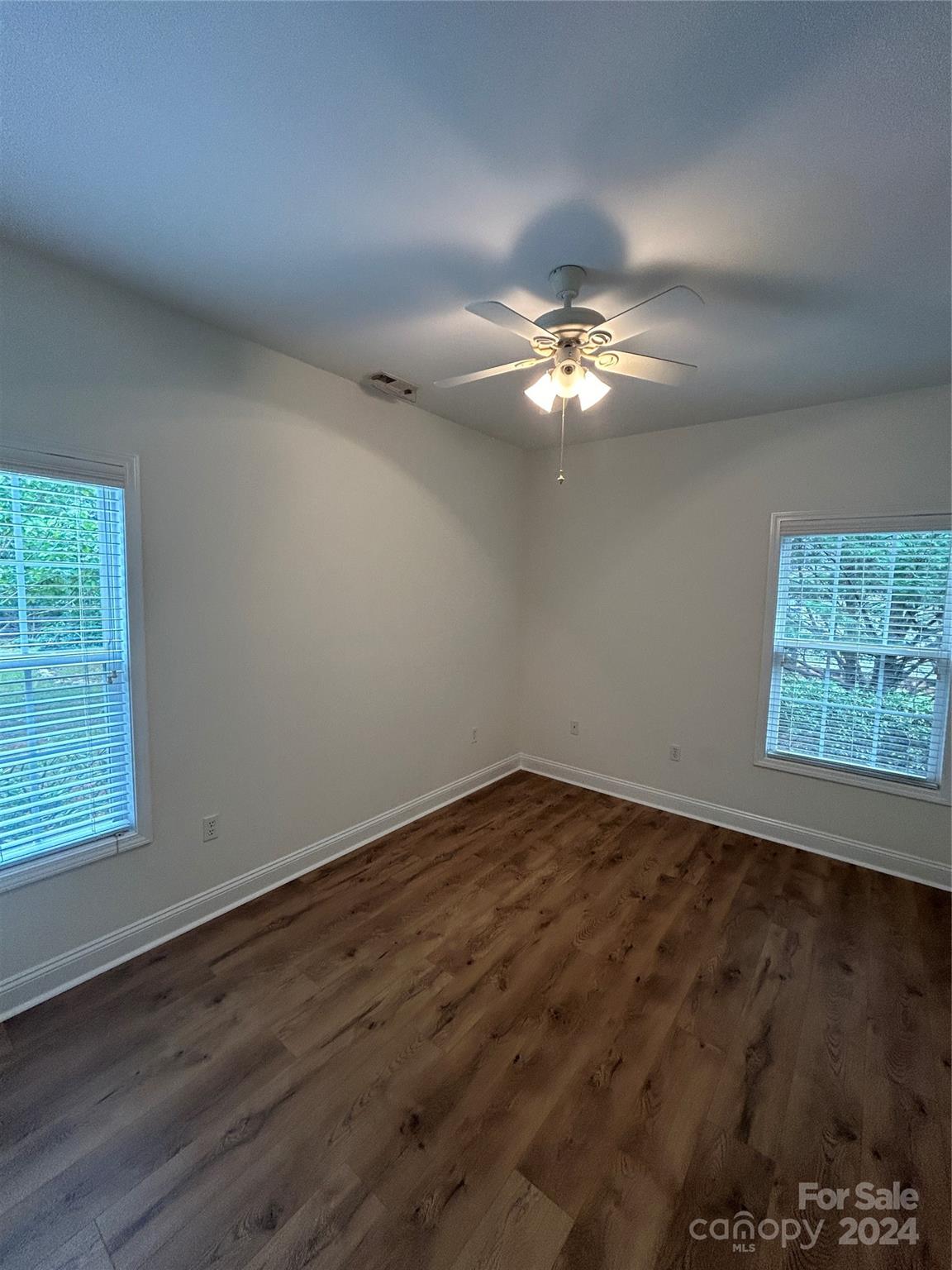 993 West Shiloh Unity Road Lancaster, SC 29720 - Photo 15 of 26 wooden floor in an empty room with a window