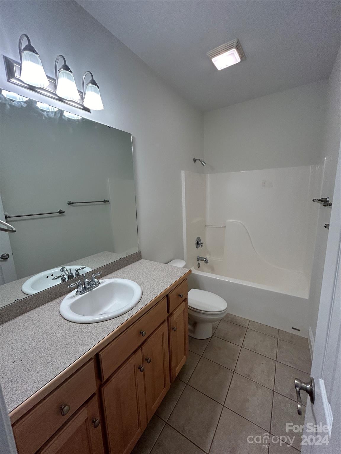 993 West Shiloh Unity Road Lancaster, SC 29720 - Photo 16 of 26 a bathroom with a granite countertop sink a toilet and a mirror