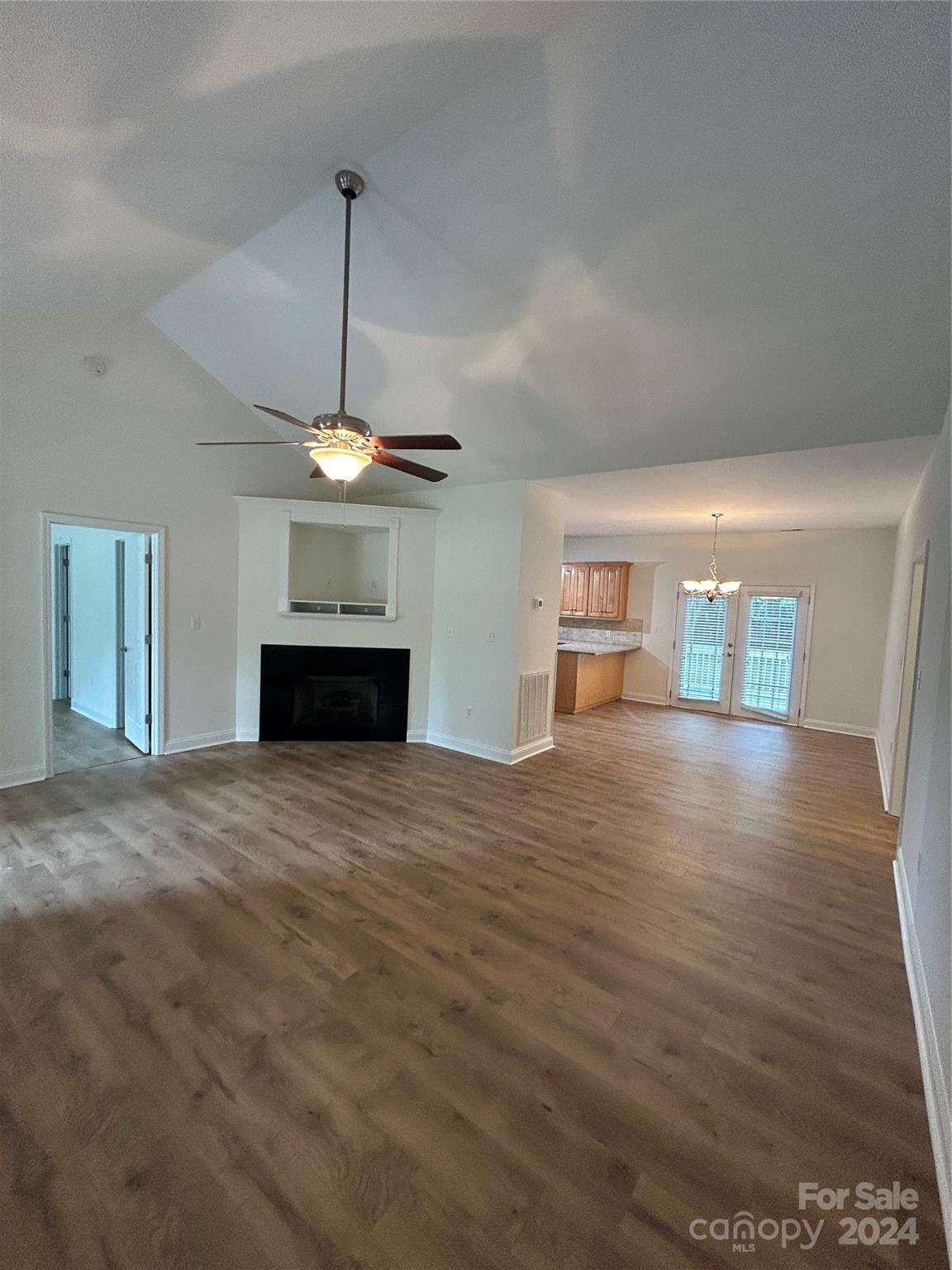 993 West Shiloh Unity Road Lancaster, SC 29720 - Photo 3 of 26 a view of empty room with fireplace and wooden floor