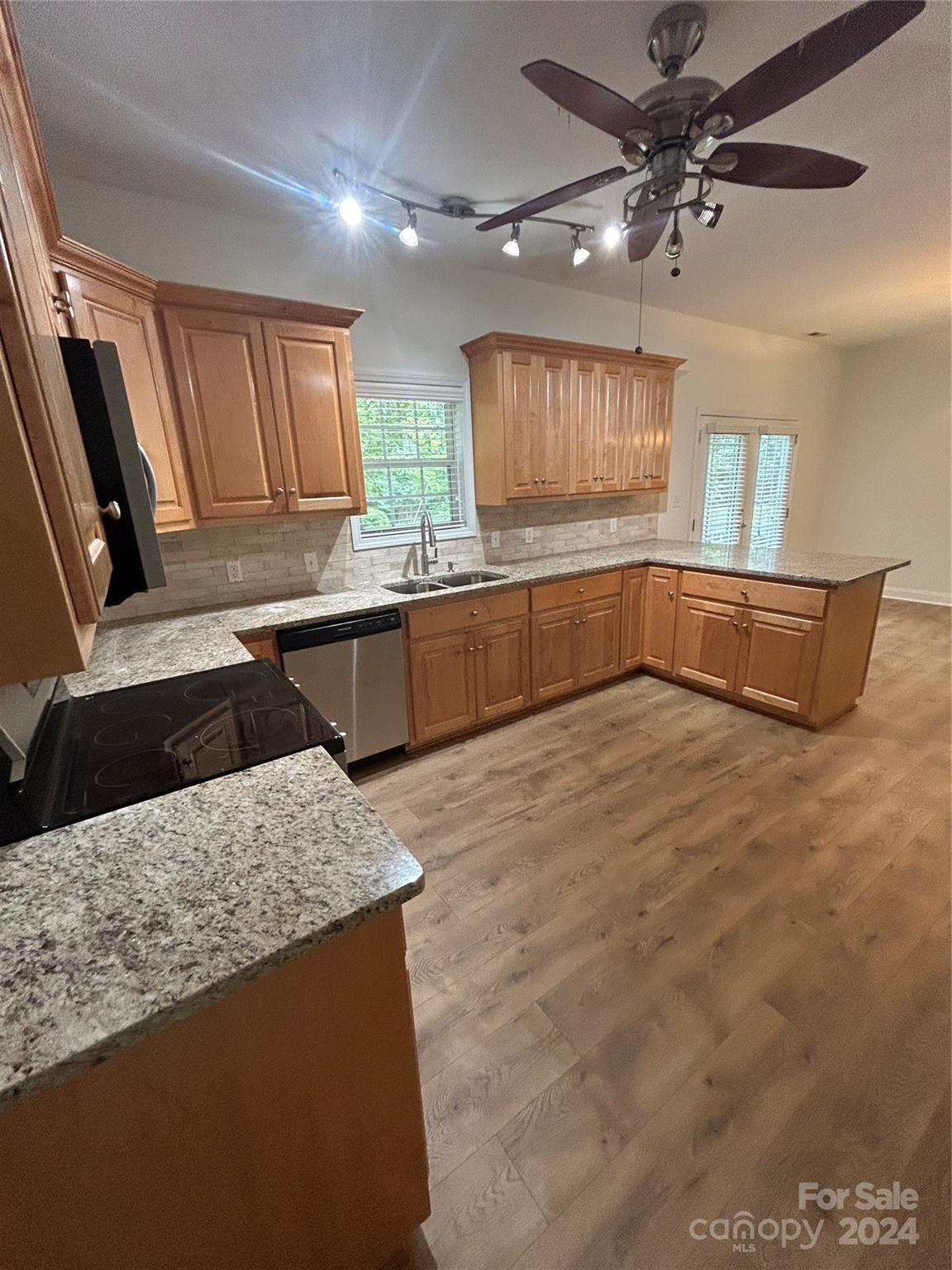 993 West Shiloh Unity Road Lancaster, SC 29720 - Photo 4 of 26 a kitchen with stainless steel appliances kitchen island granite countertop a sink window and cabinets