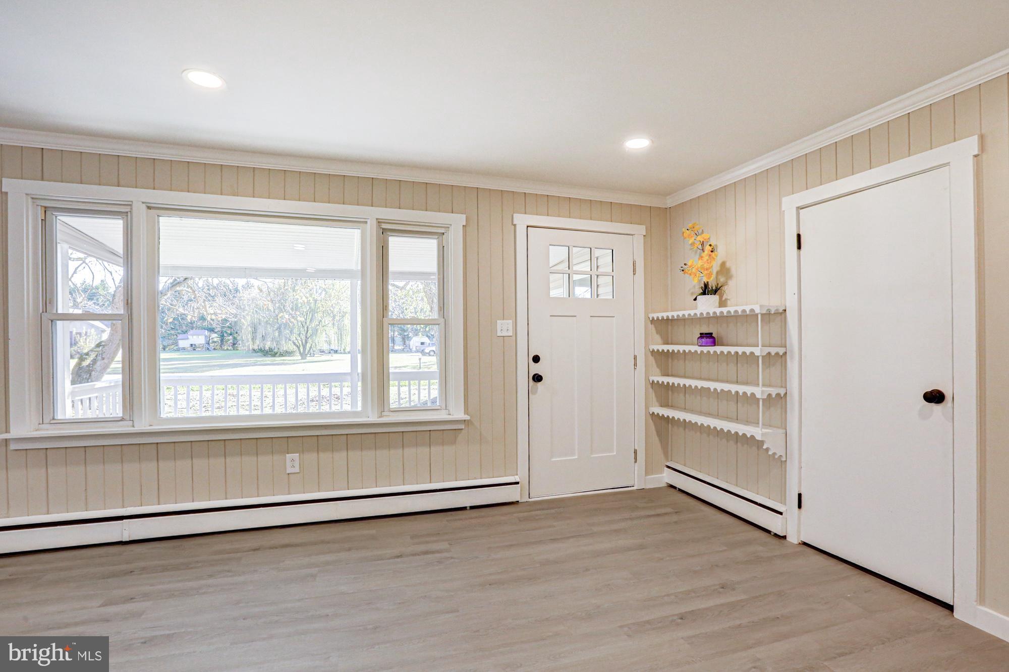 4841 Sandtown Road Felton, DE 19943 - Photo 13 of 70 a view of wooden floor and windows in a room