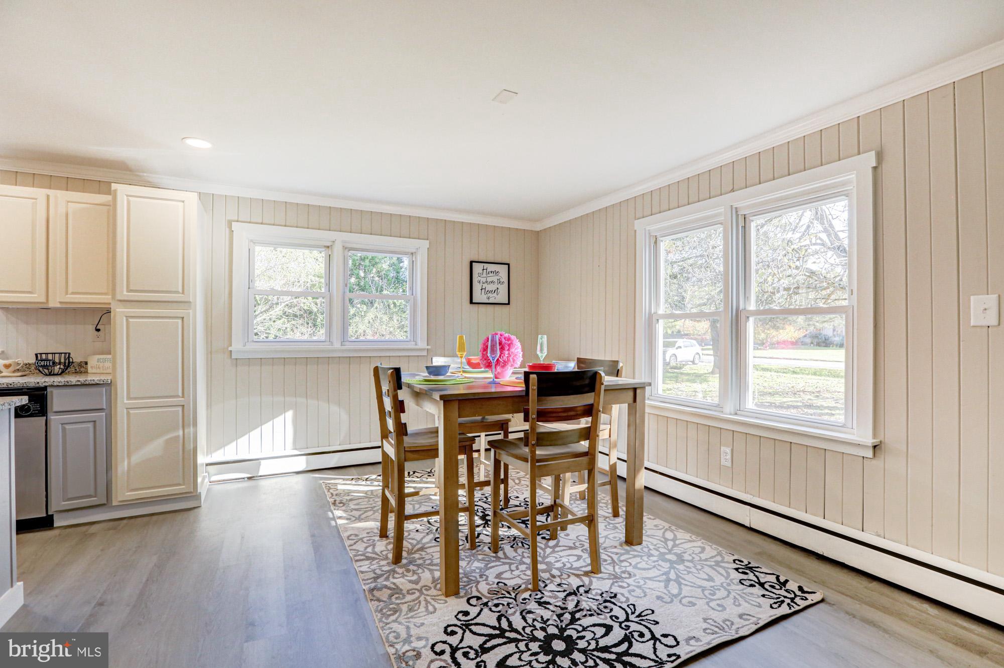 4841 Sandtown Road Felton, DE 19943 - Photo 17 of 70 a dining room with wooden floor and a window