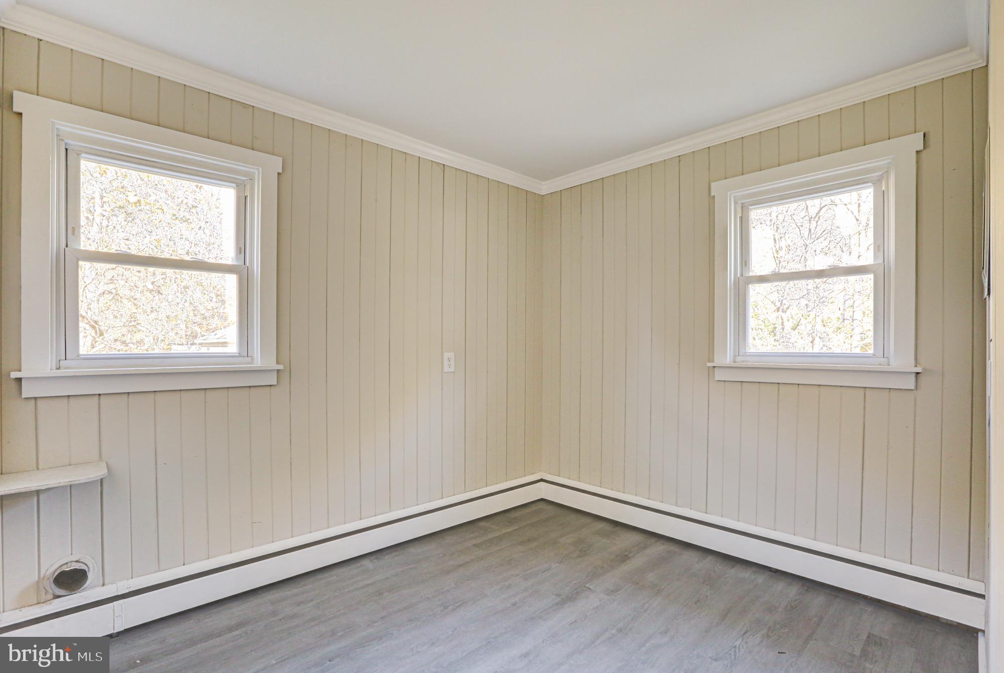 4841 Sandtown Road Felton, DE 19943 - Photo 36 of 70 an empty room with wooden floor and windows
