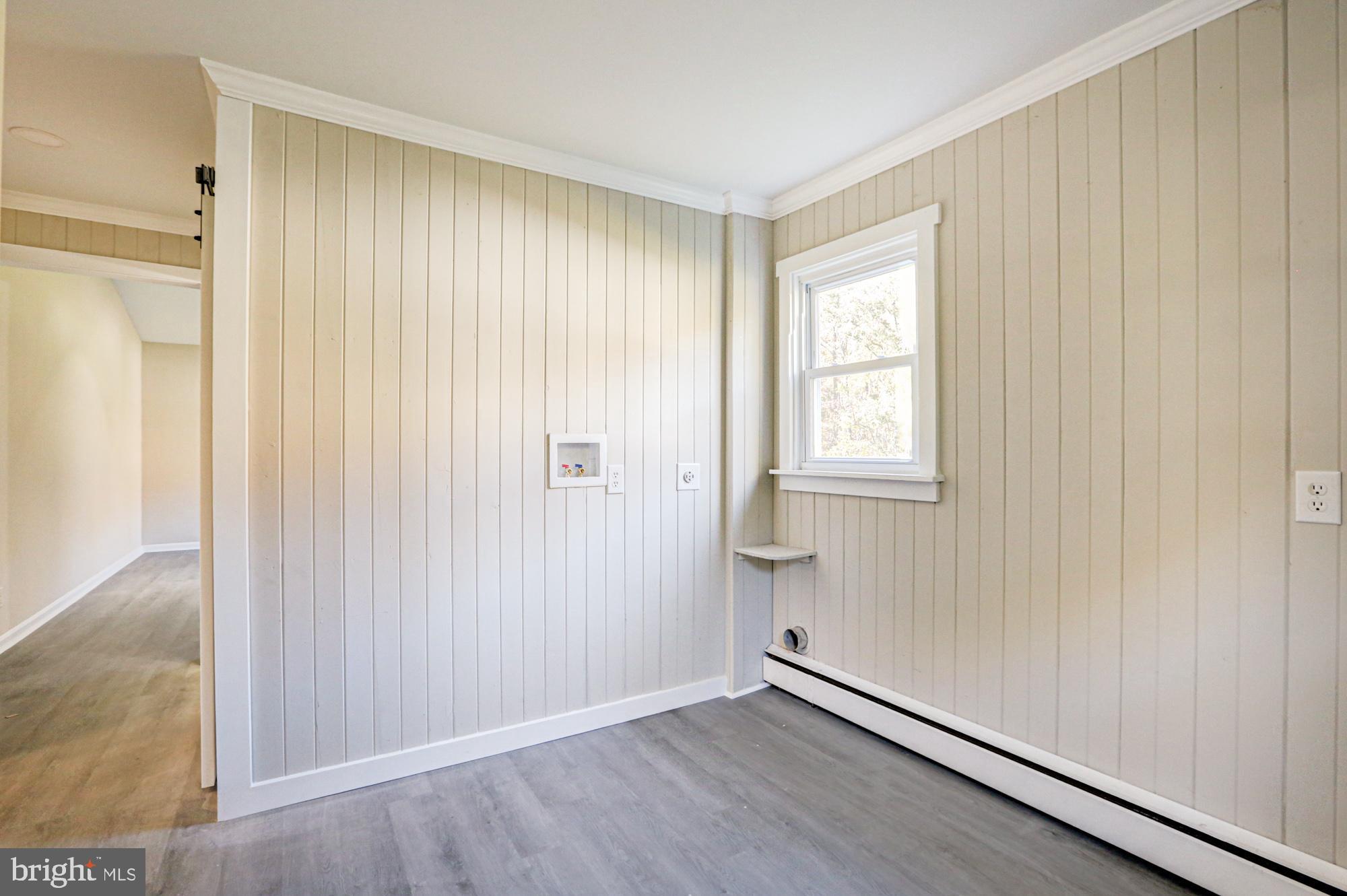 4841 Sandtown Road Felton, DE 19943 - Photo 38 of 70 an empty room with wooden floor and a window