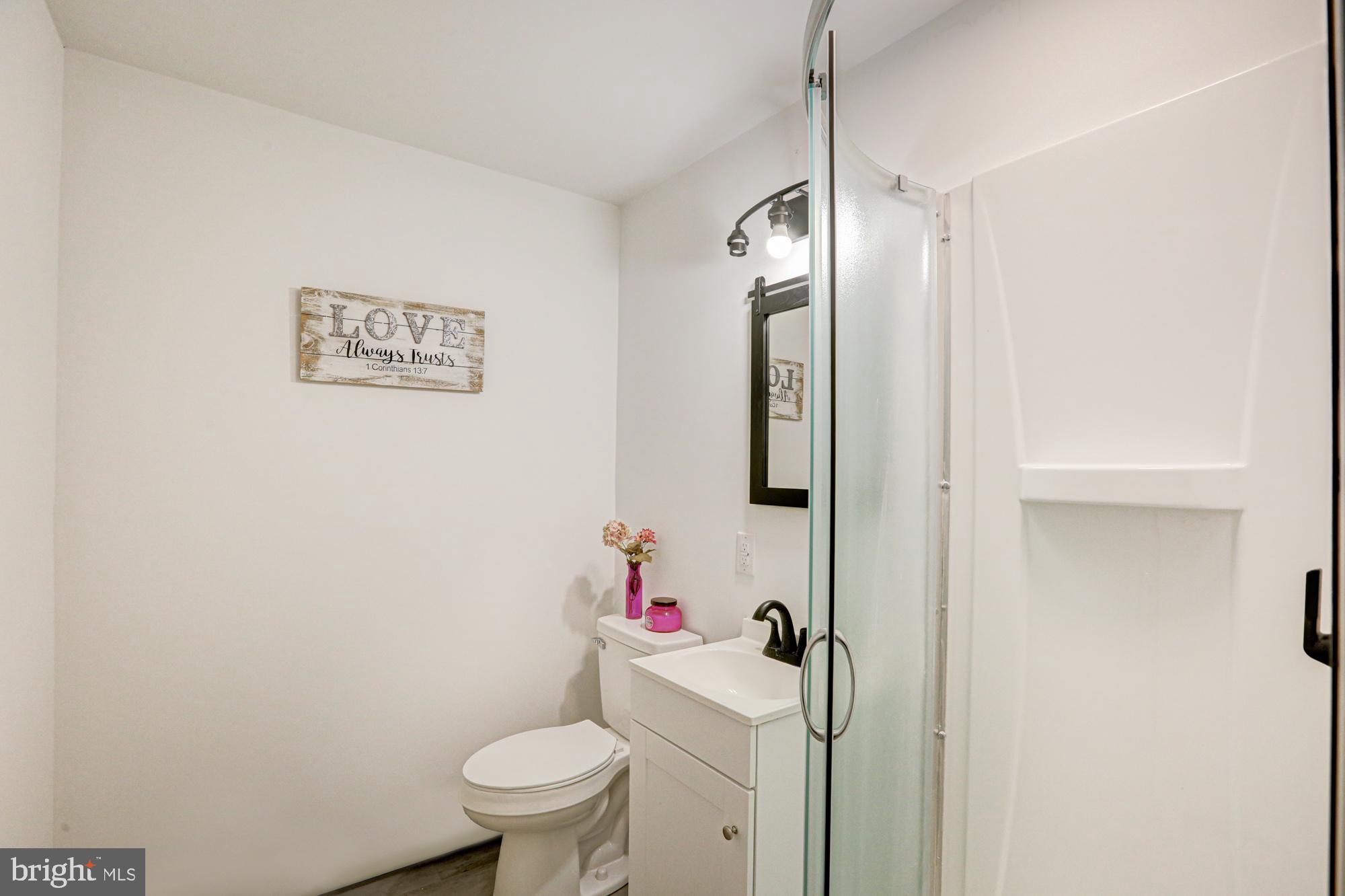 4841 Sandtown Road Felton, DE 19943 - Photo 39 of 70 a bathroom with a toilet sink and vanity