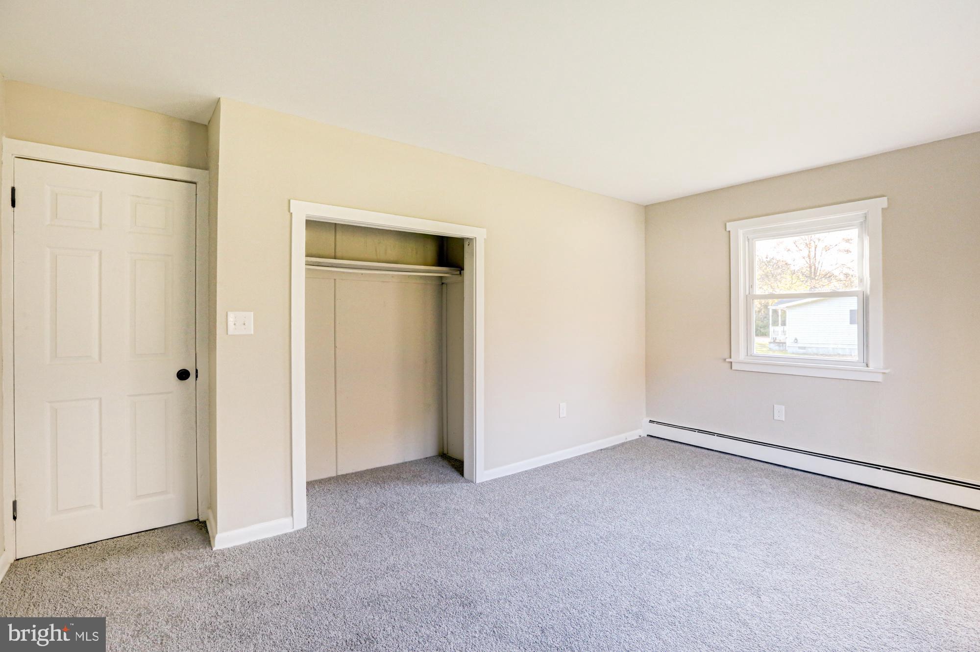 4841 Sandtown Road Felton, DE 19943 - Photo 43 of 70 an empty room with windows and closet