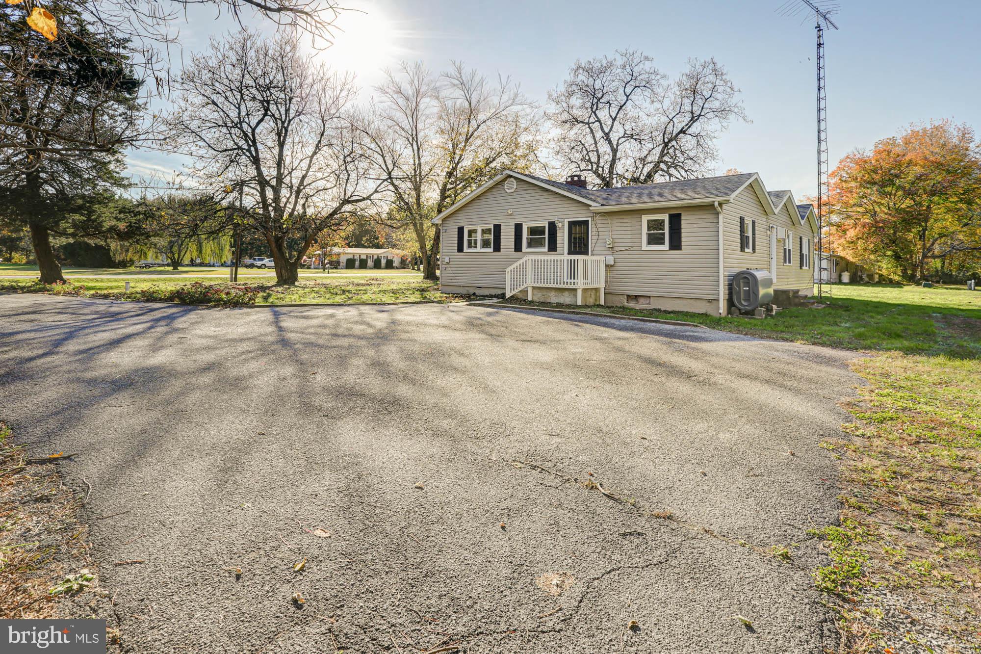 4841 Sandtown Road Felton, DE 19943 - Photo 60 of 70 a front view of a house with a yard and garage
