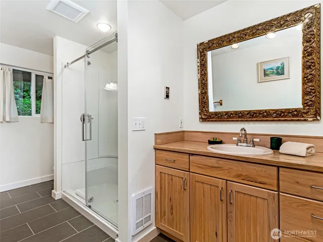 a bathroom with a shower and a tub