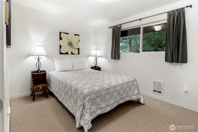 a bathroom with a shower sink and mirror