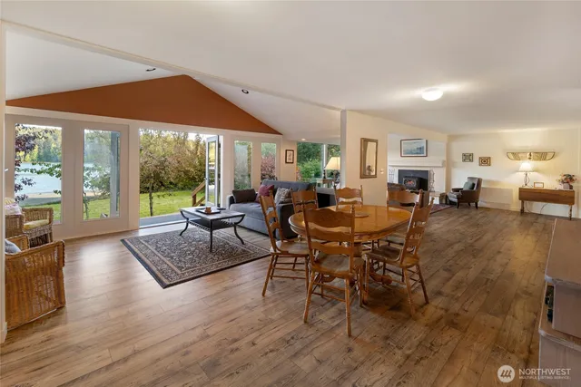 a large white kitchen with a large window