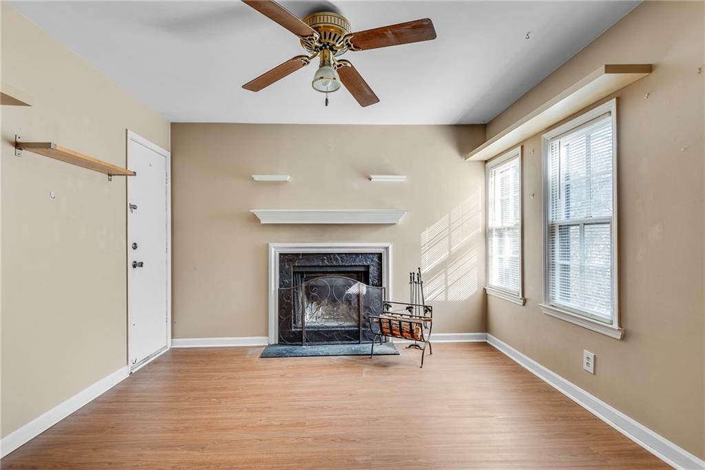 134 Lablanc Way Northwest Atlanta, GA 30327 - Photo 11 of 42 a view of a livingroom with a fireplace and window