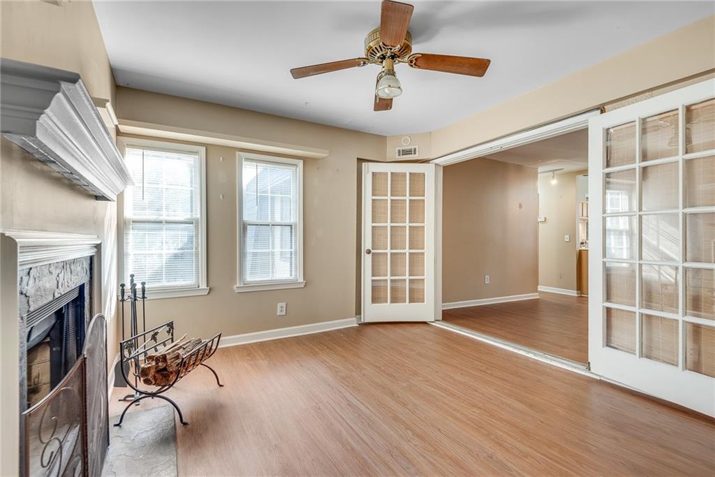 134 Lablanc Way Northwest Atlanta, GA 30327 - Photo 12 of 42 a view of livingroom with furniture hardwood floor and a ceiling fan