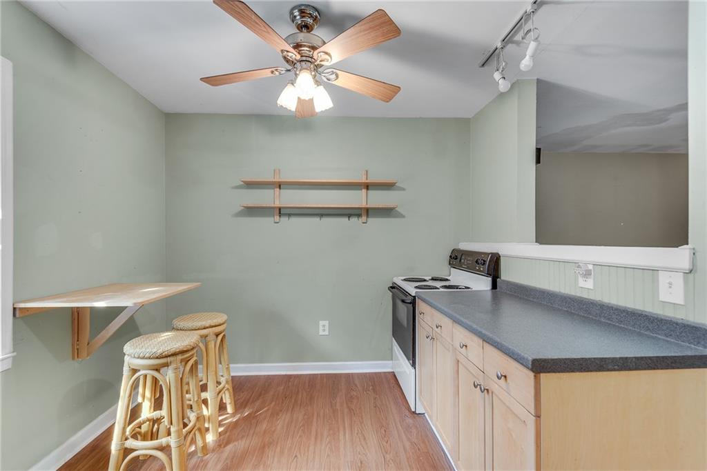 134 Lablanc Way Northwest Atlanta, GA 30327 - Photo 15 of 42 a kitchen with a sink a stove and microwave
