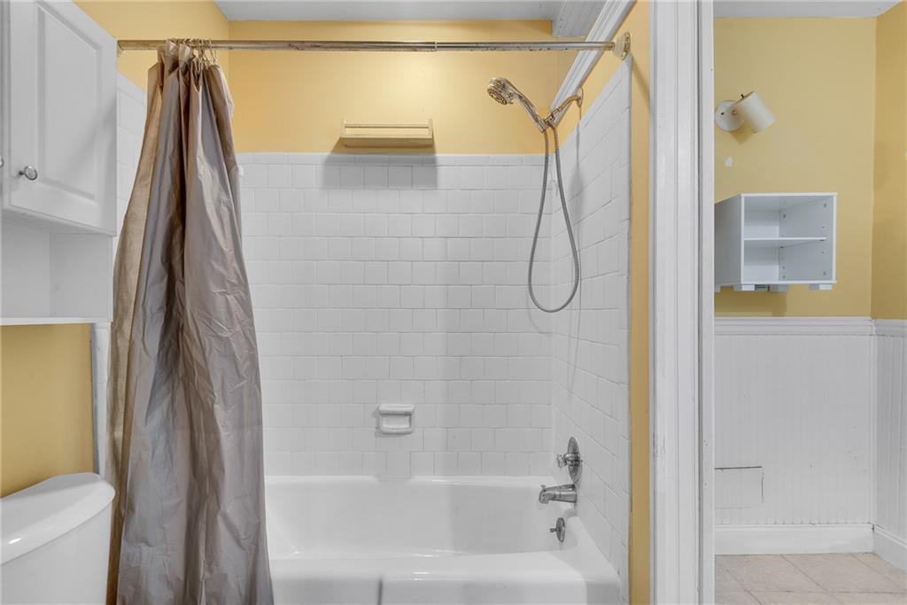 134 Lablanc Way Northwest Atlanta, GA 30327 - Photo 24 of 42 a bathroom with a shower and a shower curtain