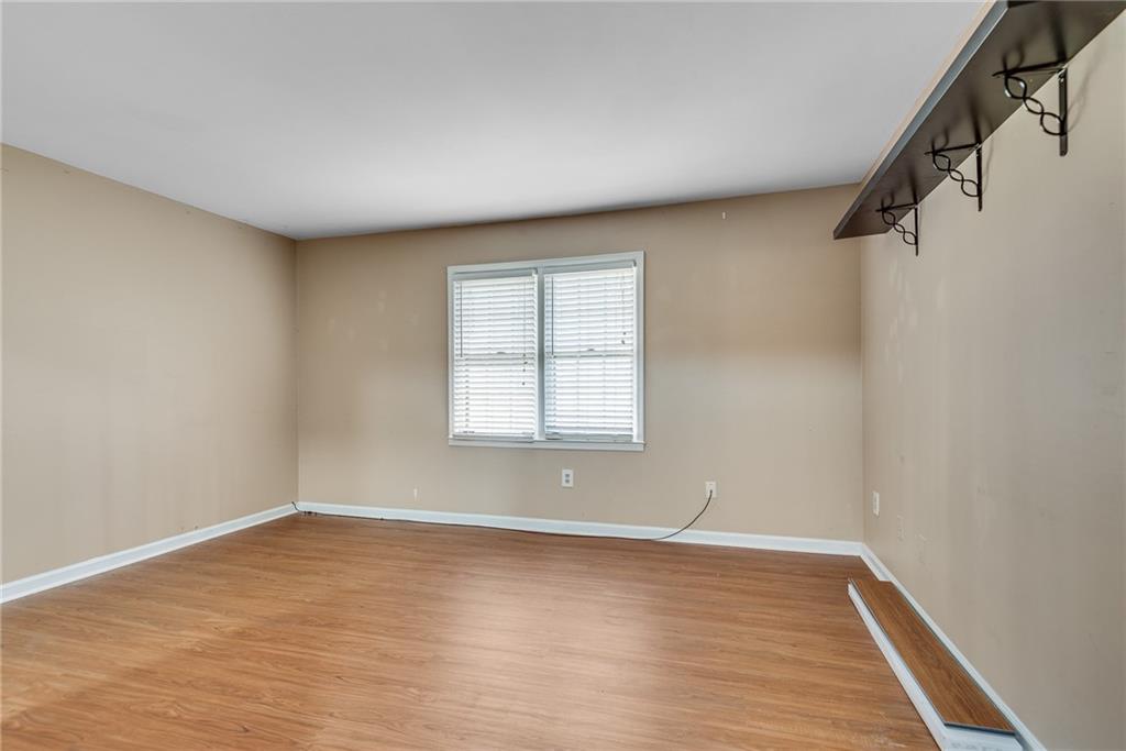 134 Lablanc Way Northwest Atlanta, GA 30327 - Photo 28 of 42 wooden floor in an empty room with a window