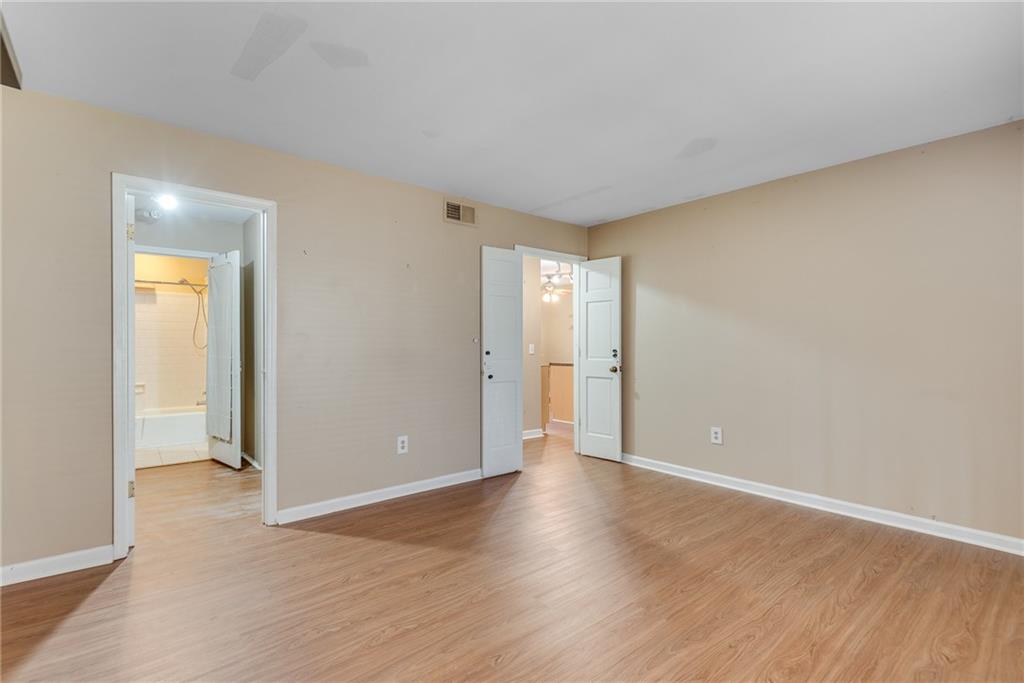 134 Lablanc Way Northwest Atlanta, GA 30327 - Photo 29 of 42 a view of wooden floor and windows in an empty room