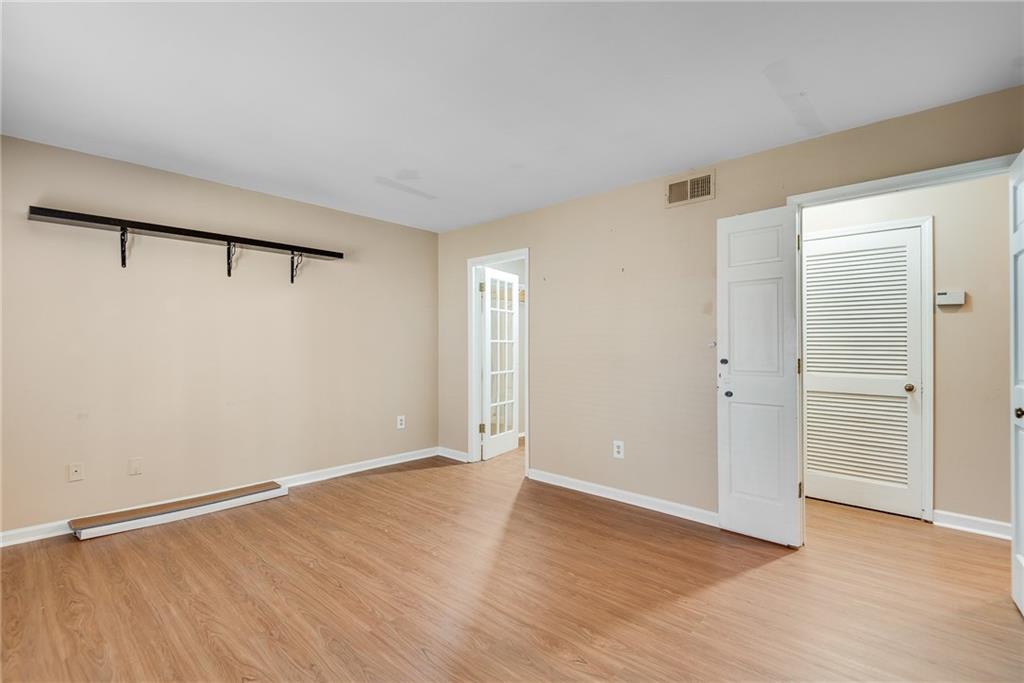 134 Lablanc Way Northwest Atlanta, GA 30327 - Photo 30 of 42 a view of an empty room with wooden floor