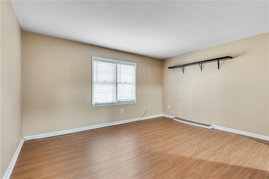 134 Lablanc Way Northwest Atlanta, GA 30327 - Photo 31 of 42 an empty room with wooden floor and windows