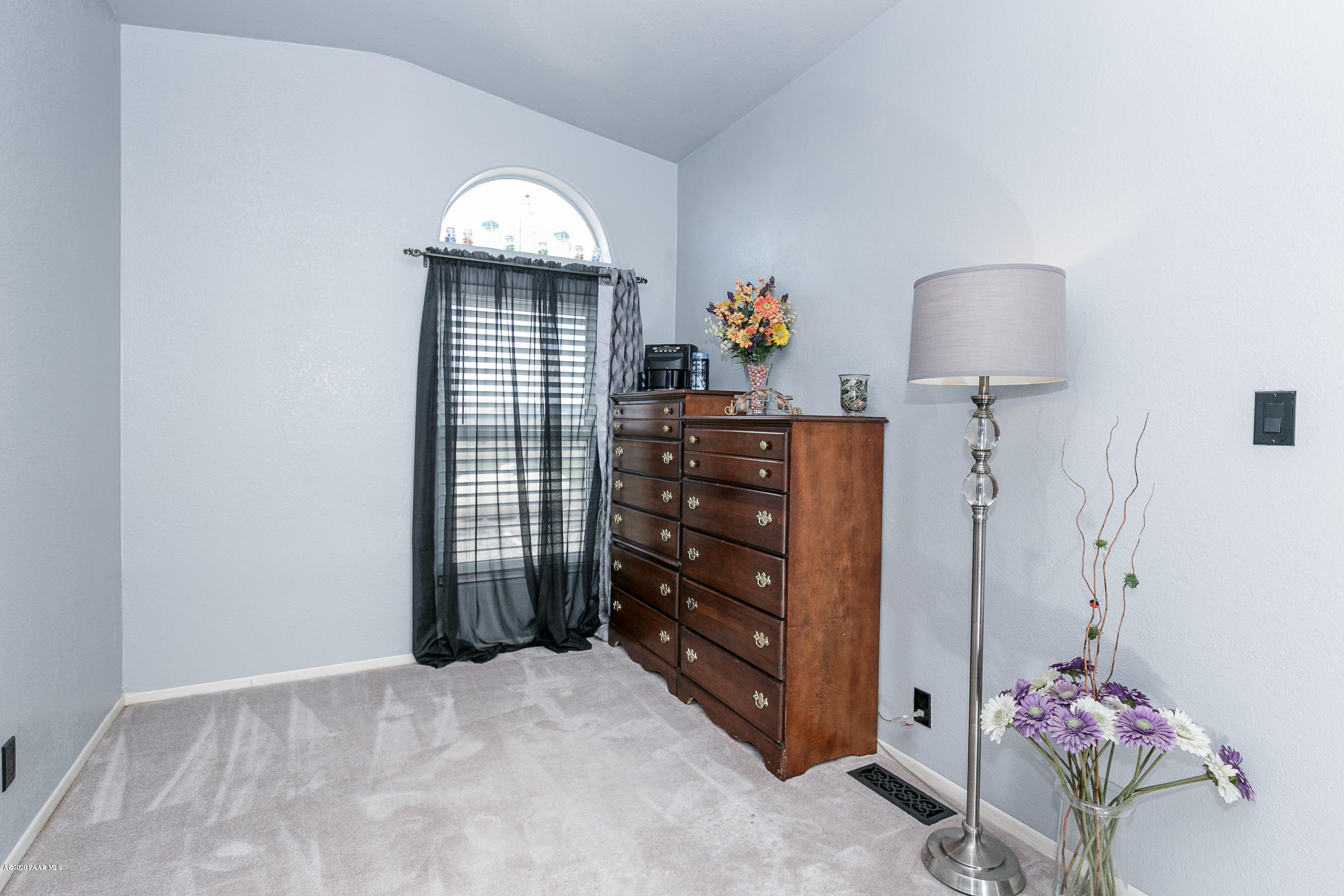 22355 North Docs Road Paulden, AZ 86334 - Photo 13 of 39 a bedroom with a dresser and a chandelier