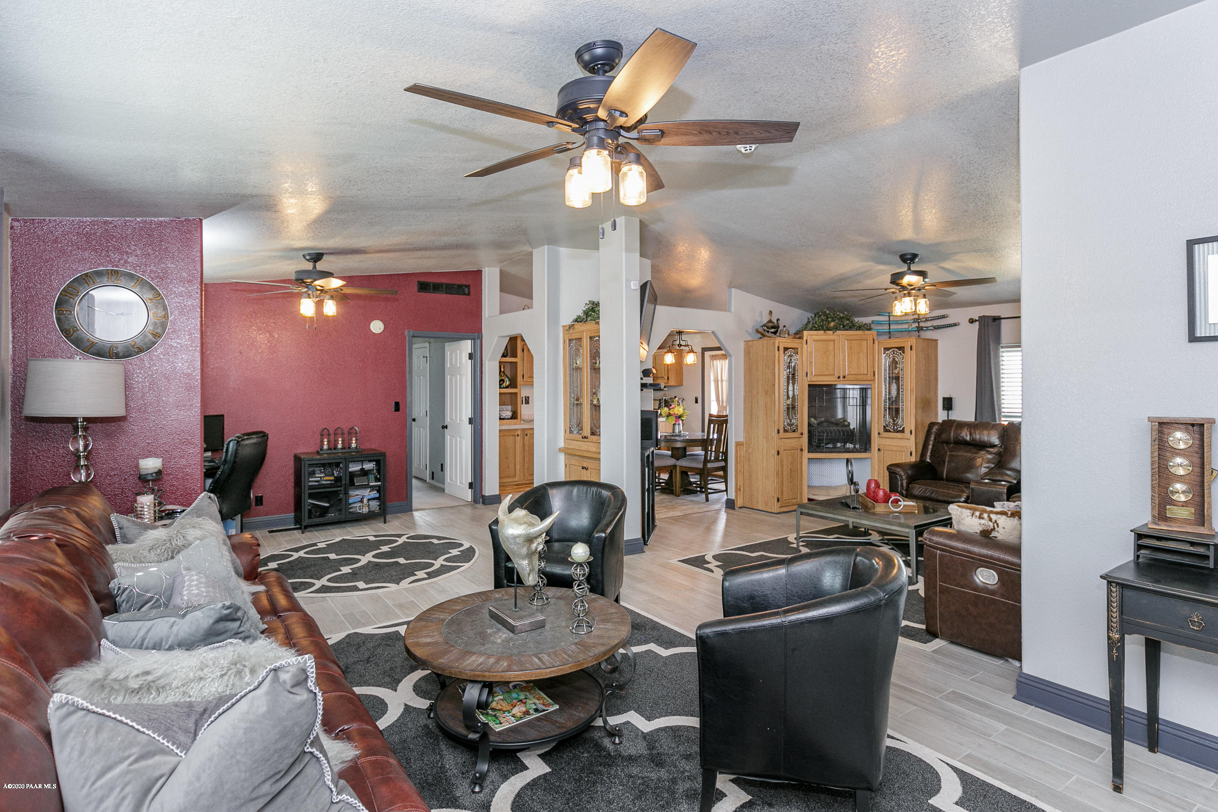 22355 North Docs Road Paulden, AZ 86334 - Photo 3 of 39 a living room with furniture a chandelier fan and a rug