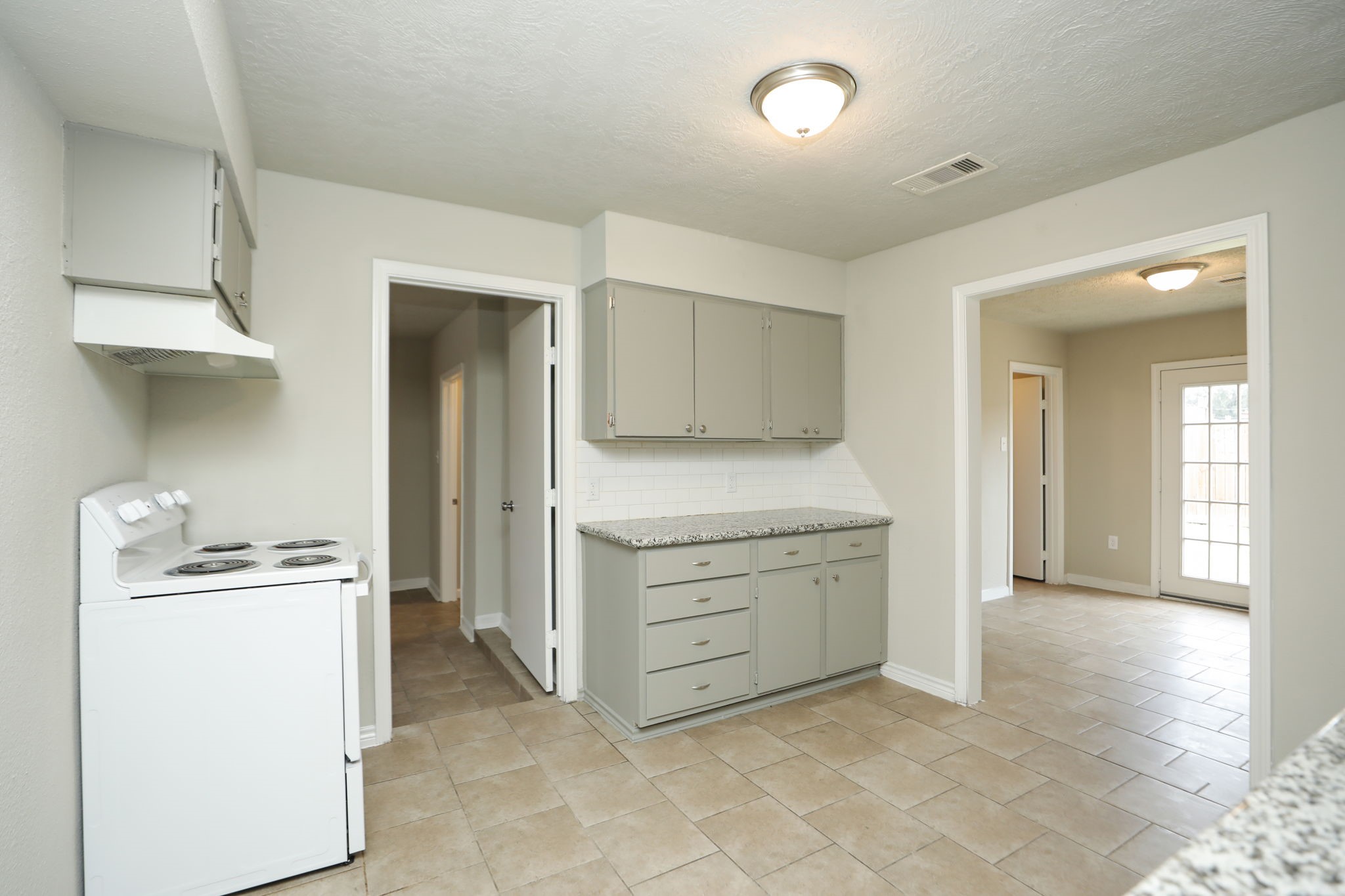 718 Champs Street Channelview, TX 77530 - Photo 12 of 31 a view of a storage & utility room with cabinets