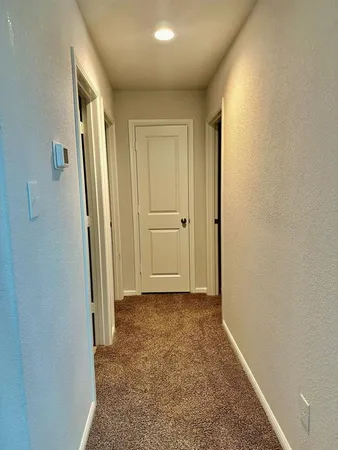 an empty room with an entryway door