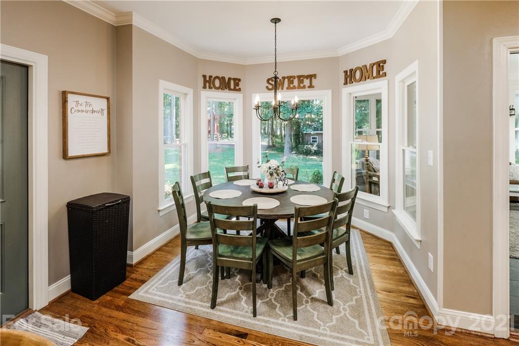 1172 Ben Black Road Midland, NC 28107 - Photo 13 of 48 a view of a dining room with furniture window and wooden floor