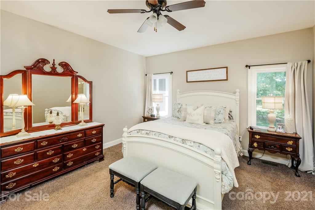 1172 Ben Black Road Midland, NC 28107 - Photo 17 of 48 a bedroom with a bed and a dresser